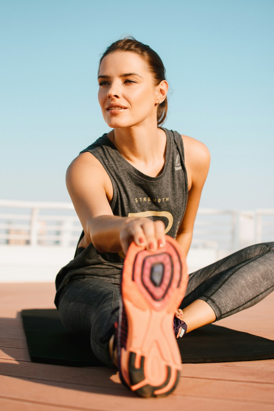 Golf mobility stretch on a mat